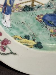 A pair of Chinese famille rose 'ladies in a garden' plates, Yongzheng