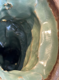 A Chinese Longquan celadon Guanyin, Ming or later