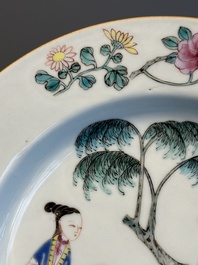 A pair of Chinese famille rose 'ladies in a garden' plates, Yongzheng