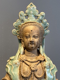 A Chinese Longquan celadon Guanyin, Ming or later