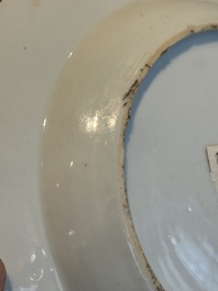 A pair of Chinese famille rose 'ladies in a garden' plates, Yongzheng