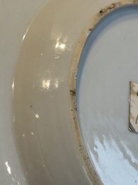 A pair of Chinese famille rose 'ladies in a garden' plates, Yongzheng