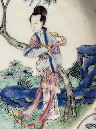 A pair of Chinese famille rose 'ladies in a garden' plates, Yongzheng