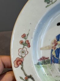 A pair of Chinese famille rose 'ladies in a garden' plates, Yongzheng