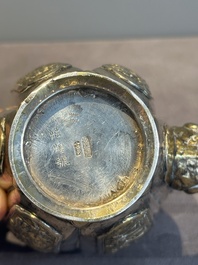 A Chinese parcel-gilt silver wine ewer for the Peranakan or Straits market,  Xuan Huang Hao 炫煌號 and An Yi Zao 安益造 mark, 19/20th C.