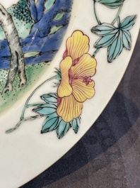 A pair of Chinese famille rose 'ladies in a garden' plates, Yongzheng