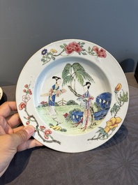 A pair of Chinese famille rose 'ladies in a garden' plates, Yongzheng