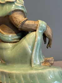 A Chinese Longquan celadon Guanyin, Ming or later
