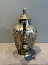 A Chinese parcel-gilt silver wine ewer for the Peranakan or Straits market,  Xuan Huang Hao 炫煌號 and An Yi Zao 安益造 mark, 19/20th C.