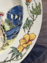 A pair of Chinese famille rose 'ladies in a garden' plates, Yongzheng