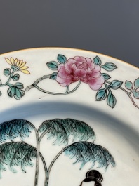 A pair of Chinese famille rose 'ladies in a garden' plates, Yongzheng