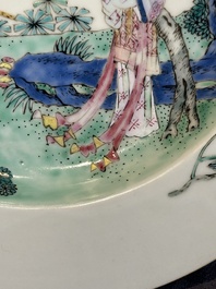 A pair of Chinese famille rose 'ladies in a garden' plates, Yongzheng