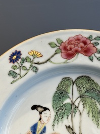 A pair of Chinese famille rose 'ladies in a garden' plates, Yongzheng
