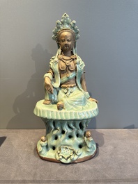 A Chinese Longquan celadon Guanyin, Ming or later