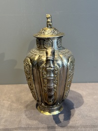 A Chinese parcel-gilt silver wine ewer for the Peranakan or Straits market,  Xuan Huang Hao 炫煌號 and An Yi Zao 安益造 mark, 19/20th C.