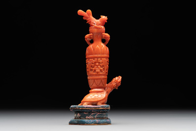 A Chinese carved red coral 'mythical animals' snuff bottle on stand, 19/20th C.