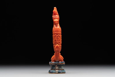 A Chinese carved red coral 'mythical animals' snuff bottle on stand, 19/20th C.