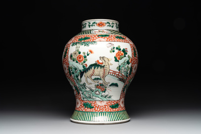 A Chinese famille verte 'mythical animal' vase and two Canton famille rose vases, 19th C.