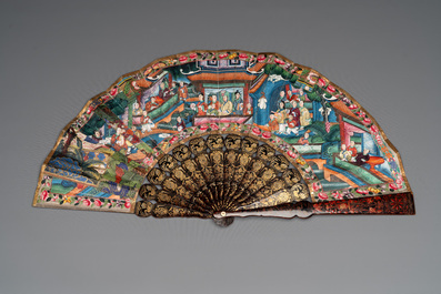 Two Chinese Canton gilt-lacquered and painted paper fans, one with original box, 19th C.