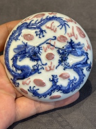 A pair of Chinese blue and white and a pair of blue, white and copper-red seal paste boxes, Kangxi and Qianlong mark, 19th C.