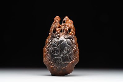 A rare Chinese carved rhinoceros horn 'libation cup' with grape design, 17/18th C.
