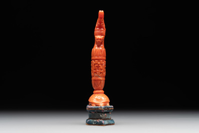 A Chinese carved red coral 'mythical animals' snuff bottle on stand, 19/20th C.