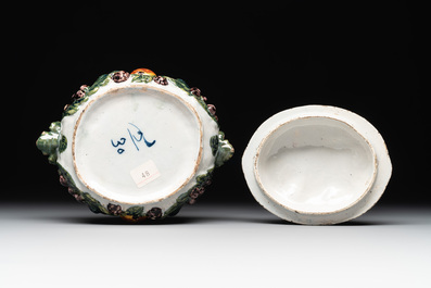 A polychrome Dutch Delft butter tub in the shape of various fruits, 18th C.