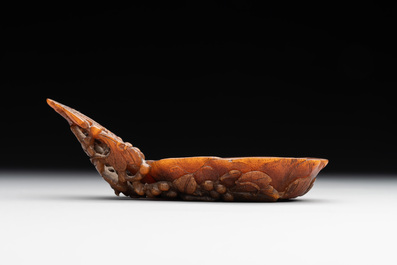 A rare Chinese carved rhinoceros horn 'libation cup' with grape design, 17/18th C.