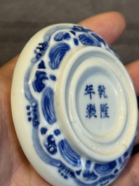 A pair of Chinese blue and white and a pair of blue, white and copper-red seal paste boxes, Kangxi and Qianlong mark, 19th C.