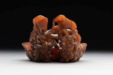 A rare Chinese carved rhinoceros horn 'libation cup' with grape design, 17/18th C.