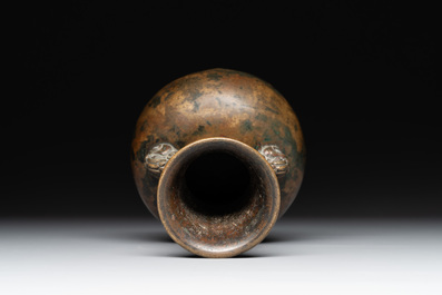 A small Chinese bronze bottle vase with lion-form handles, Qing, 17th C.