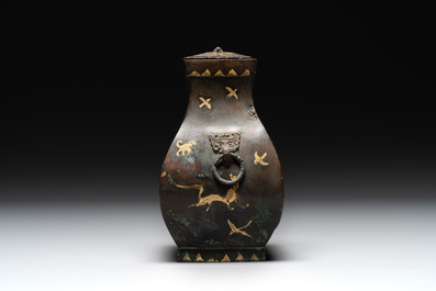 A rare Chinese archaic partially gilt bronze ritual wine vessel and cover, 'fang hu 方壺', Han