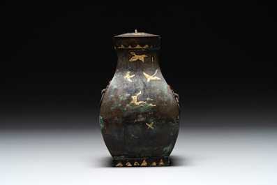A rare Chinese archaic partially gilt bronze ritual wine vessel and cover, 'fang hu 方壺', Han