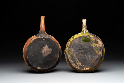 Five pieces of glazed earthenware cooking utensils and a fire bell, probably The Netherlands, 17th C.