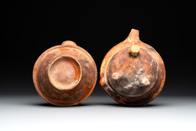 Five pieces of glazed earthenware cooking utensils and a fire bell, probably The Netherlands, 17th C.