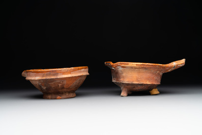 Five pieces of glazed earthenware cooking utensils and a fire bell, probably The Netherlands, 17th C.