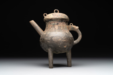 A Chinese inscribed archaic bronze tripod ritual wine vessel and cover, 'He 盉', Western Zhou