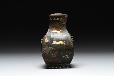 A rare Chinese archaic partially gilt bronze ritual wine vessel and cover, 'fang hu 方壺', Han
