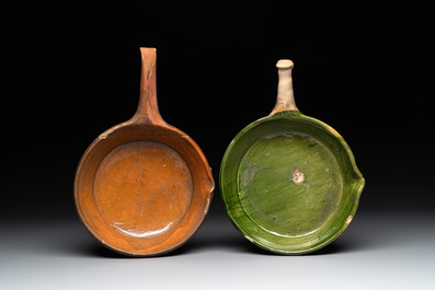 Five pieces of glazed earthenware cooking utensils and a fire bell, probably The Netherlands, 17th C.