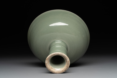 A Chinese Longquan celadon stem cup and two saucers, Ming