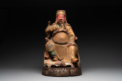 A large Chinese gilt- and polychromed wooden sculpture of a divinity, 19th C.