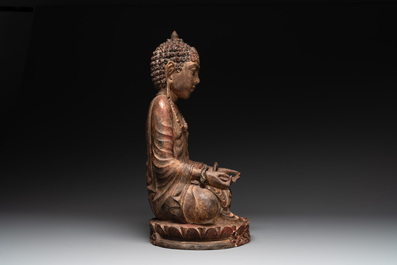 A Southeast Asian gilt-lacquered wooden sculpture of a praying ascetic, 18/19th C.