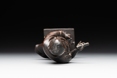 A fine Chinese bronze Luohan holding a sutra, Ming