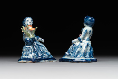 A pair of polychrome Dutch Delft groups of merchant ladies, 18th C.