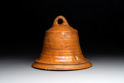 Five pieces of glazed earthenware cooking utensils and a fire bell, probably The Netherlands, 17th C.