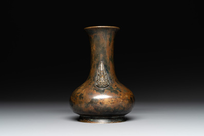 A small Chinese bronze bottle vase with lion-form handles, Qing, 17th C.