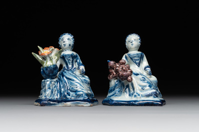 A pair of polychrome Dutch Delft groups of merchant ladies, 18th C.