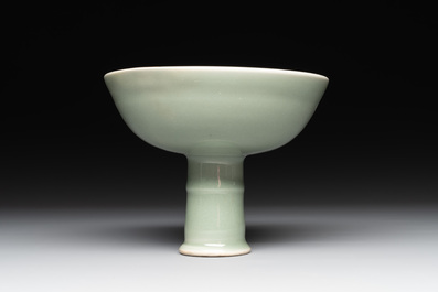 A Chinese Longquan celadon stem cup and two saucers, Ming