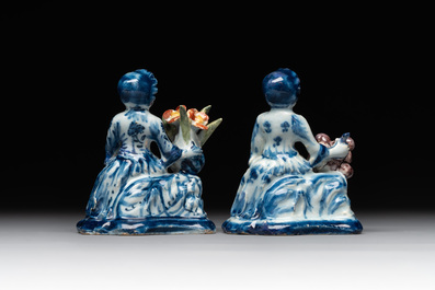 A pair of polychrome Dutch Delft groups of merchant ladies, 18th C.