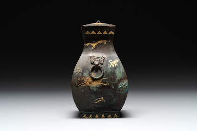 A rare Chinese archaic partially gilt bronze ritual wine vessel and cover, 'fang hu 方壺', Han